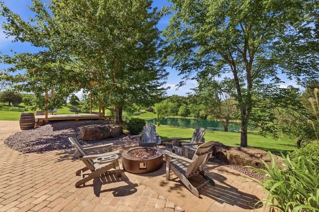 Lower patio fire pit with the pond beyond