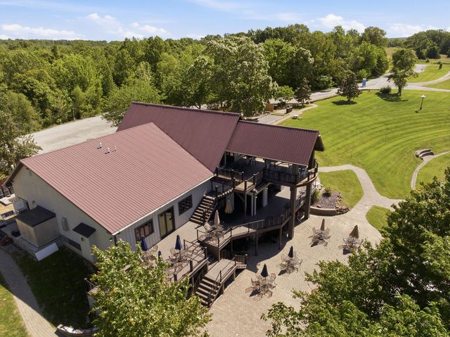 Roof, decks and gravel court from above