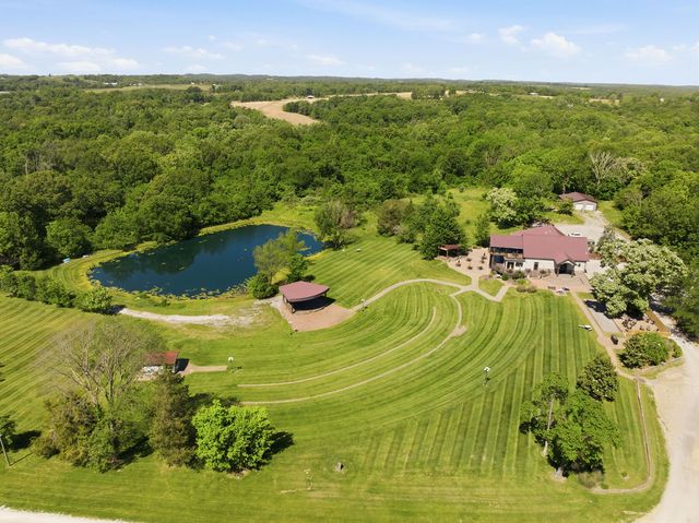 Amphitheater, stage, pond and lodge