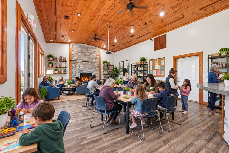 Conceptual rendering — digitally altered: Community & nonprofit, dining room, view 3 of 10, made from the photograph “Dining room with cathedral pine ceiling and stone fireplace”.