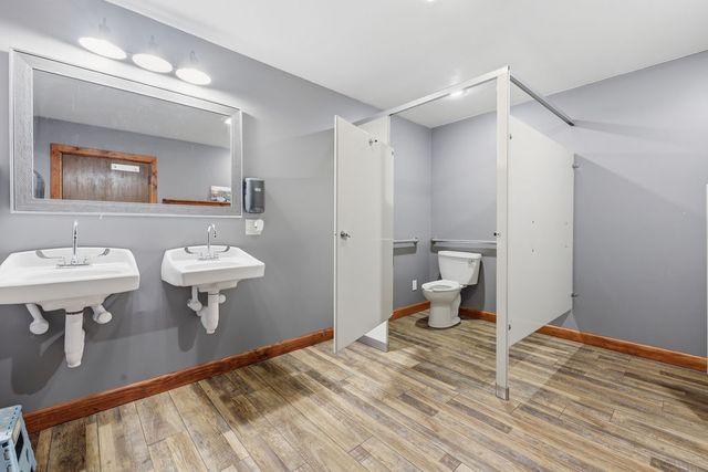 Restroom with two lavatories and accessible stall