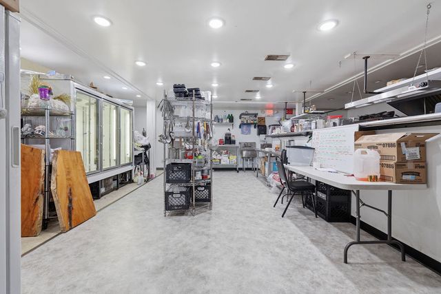 Commercial kitchen toward the reach-in coolers