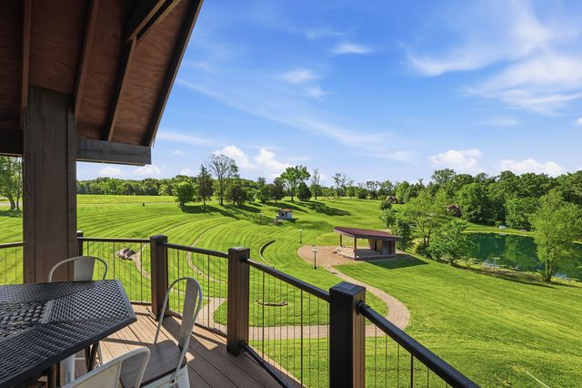View from the covered upper deck over the terraced lawn, stage and pond