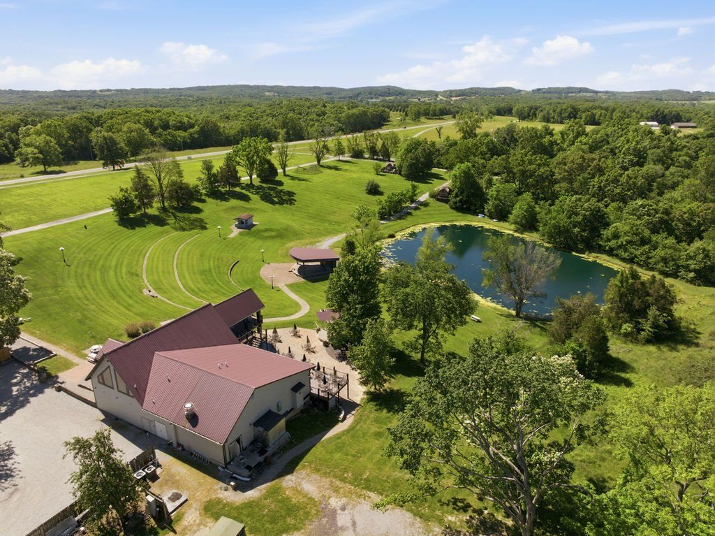 Listing photograph: Lodge, amphitheater, stage and pond toward the ridge