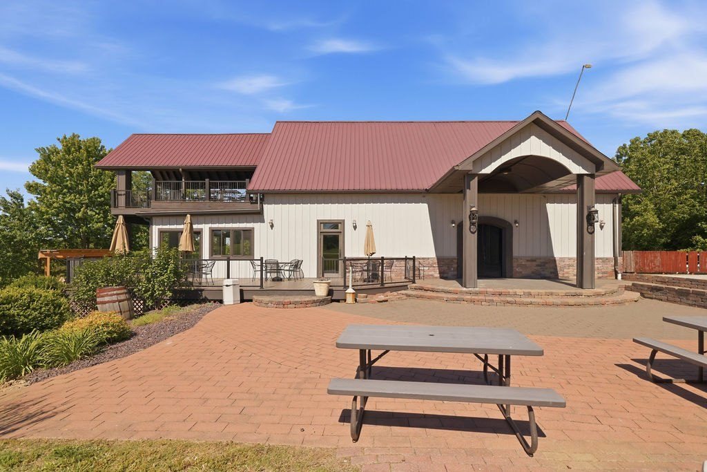 Listing photograph: Entry elevation and paver courtyard