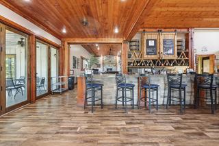 Bar and wine wall; enclosed porch through the glass doors at left