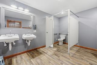 Restroom with two lavatories and accessible stall