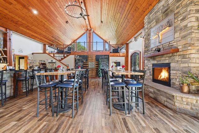 Great hall with both fireplace and loft in view. Digitally altered: fire added