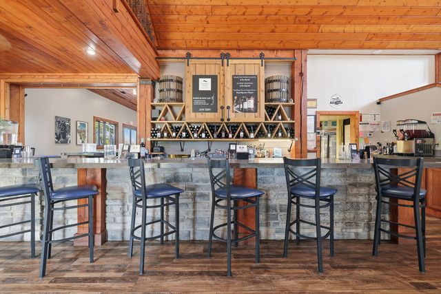 Back bar detail: barn-door cabinets, wine racks and espresso station